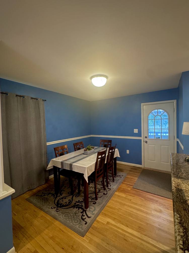 Dining area with a table set for five