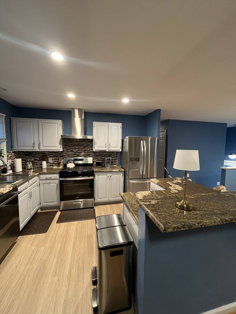 Open kitchen with a granite peninsula